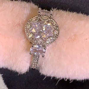 Silver Tone Ring with Large Clear Center Stone and Pave Stones